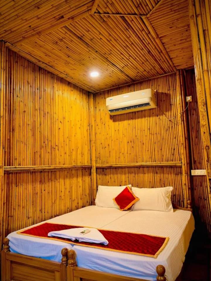 Bamboo room with double bed and wall AC